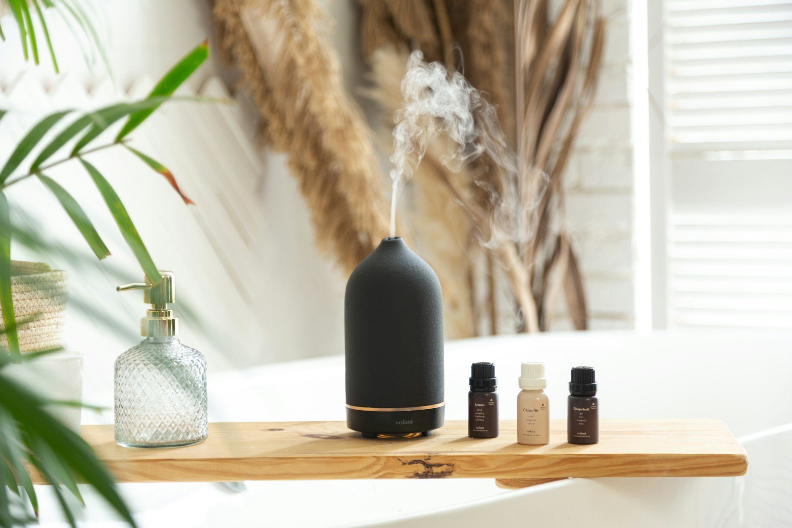 a vase of flowers on a table: Aromatherapy